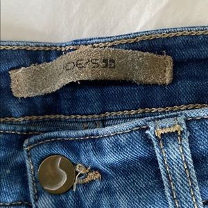 Joe’s slim fit blue jean with fringe cuffs